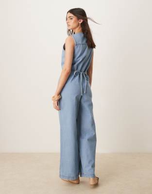 Asos Design Denim Sleeveless Jumpsuit With Tie Back In Blue