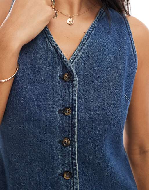 ASOS DESIGN denim sleeveless v neck dress with button up in mid wash blue