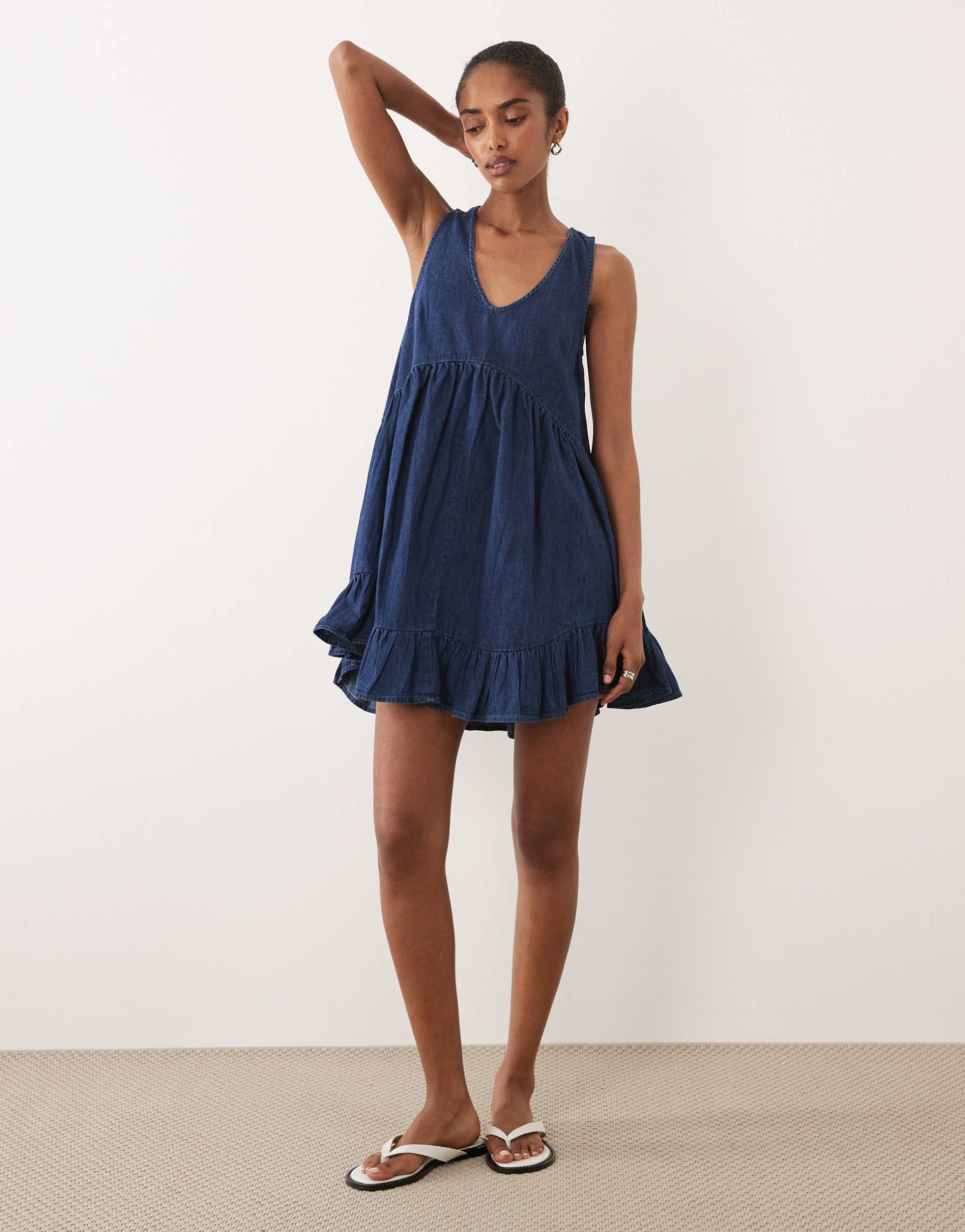 asos design denim v neck tiered smock dress in mid blue