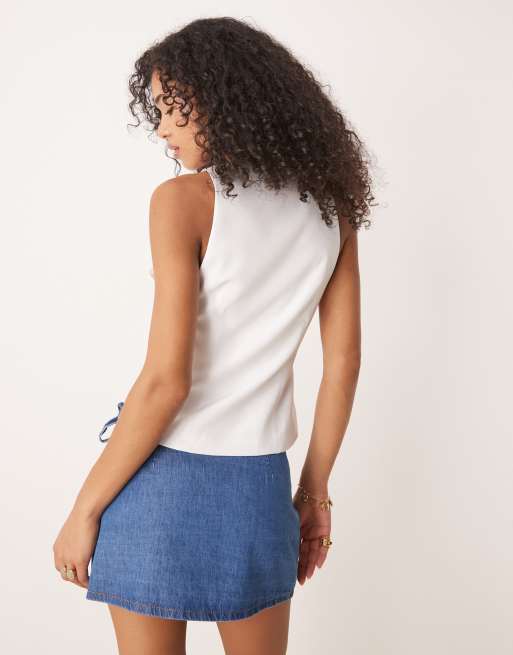 ASOS DESIGN denim wrap front mini skirt with bow detail in mid blue, 2 of 5