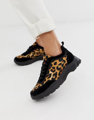 leopard and black trainers