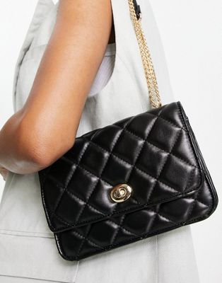 ASOS DESIGN diamond quilted crossbody with lock detail and adjustable shoulder strap in black