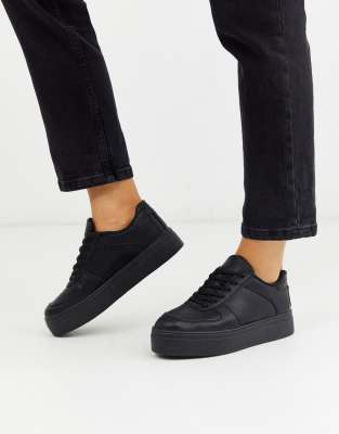 black flatform trainers