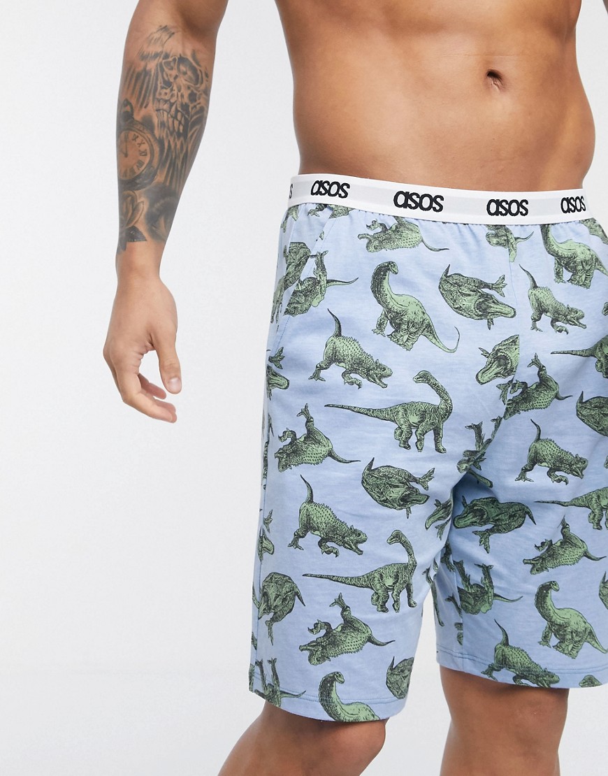 ASOS DESIGN – Dinosauriemönstrade, mysiga pyjamasshorts med logga på midjebandet-Blå