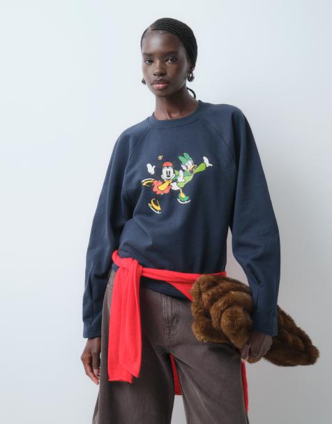 ASOS DESIGN Disney balloon sleeve sweatshirt with Minnie and Daisy print in navy - view 1