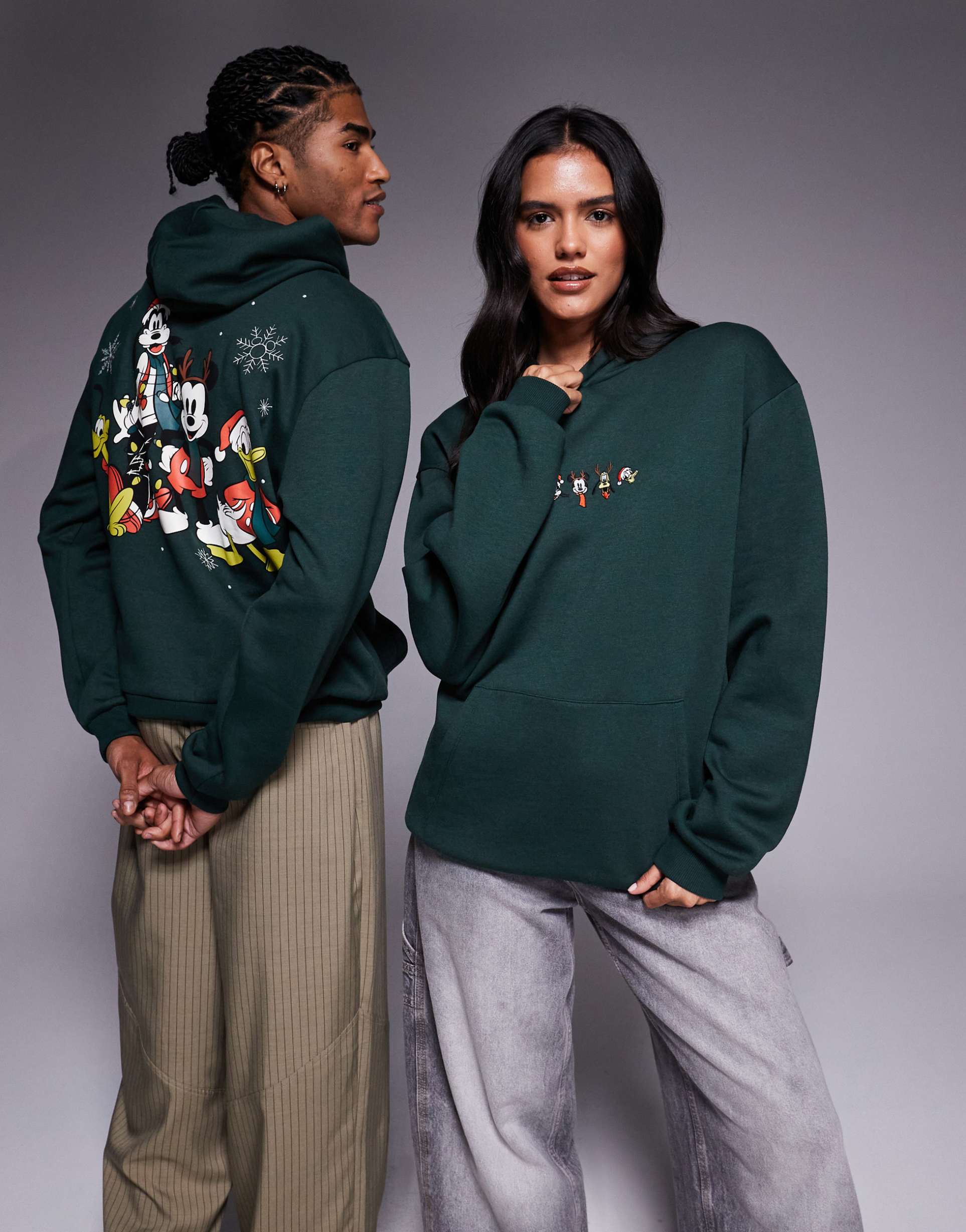 asos design disney christmas relaxed hoodie with mickey & friends prints in dark green