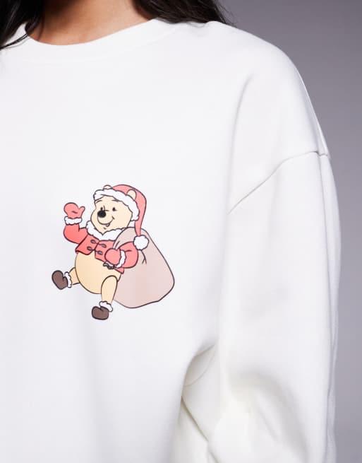 ASOS DESIGN Disney Christmas Relaxed sweatshirt with Winnie The Pooh prints in off-white