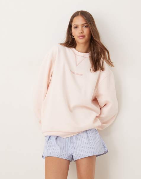 ASOS DESIGN Disney relaxed sweatshirt with Mickey Mouse print in baby pink