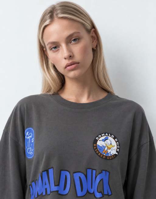 ASOS DESIGN Disney Oversized Langarm-T-Shirt mit Donald-Duck-Print in Schwarz, 8 von 10