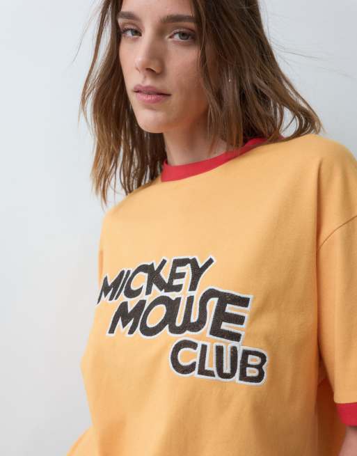 ASOS DESIGN Disney oversized ringer t-shirt with Mickey Mouse Club print in orange, 2 of 5