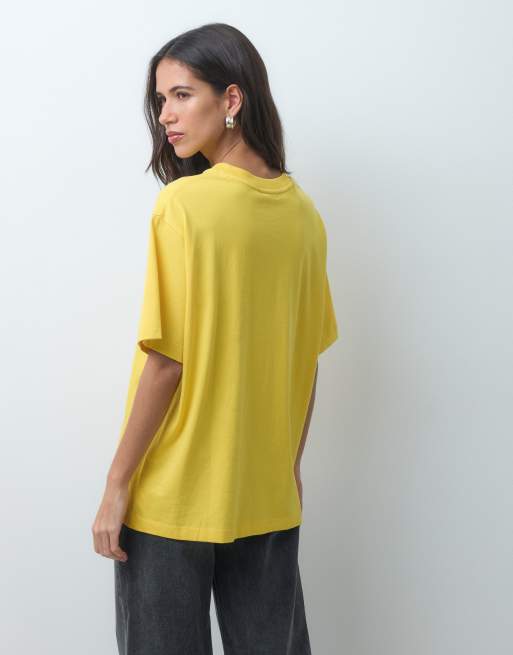 ASOS DESIGN Disney oversized t-shirt with 101 Dalmatian print in yellow, 4 of 4