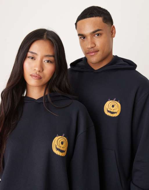 ASOS DESIGN Disney Pixar Halloween oversized hoodie with Monsters Inc. prints in navy