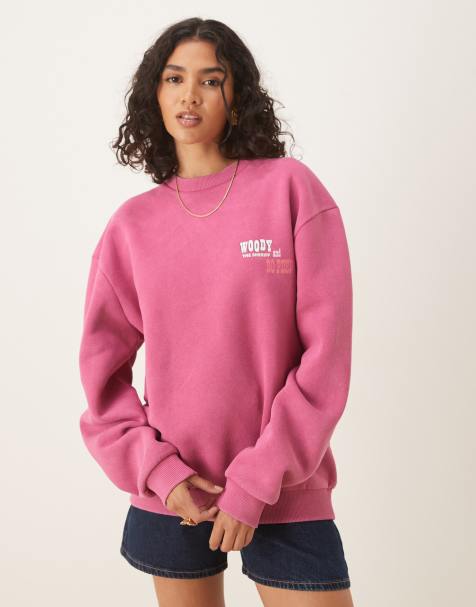 ASOS DESIGN Disney Pixar oversized sweatshirt with Woody Toy Story print in pink - view 1
