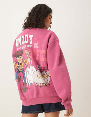 Asos Design Disney Pixar Oversized Sweatshirt With Woody Toy Story Print In Pink