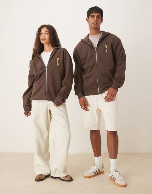 ASOS DESIGN Disney Pixar oversized zip-through hoodie with Woody Toy Story print in brown