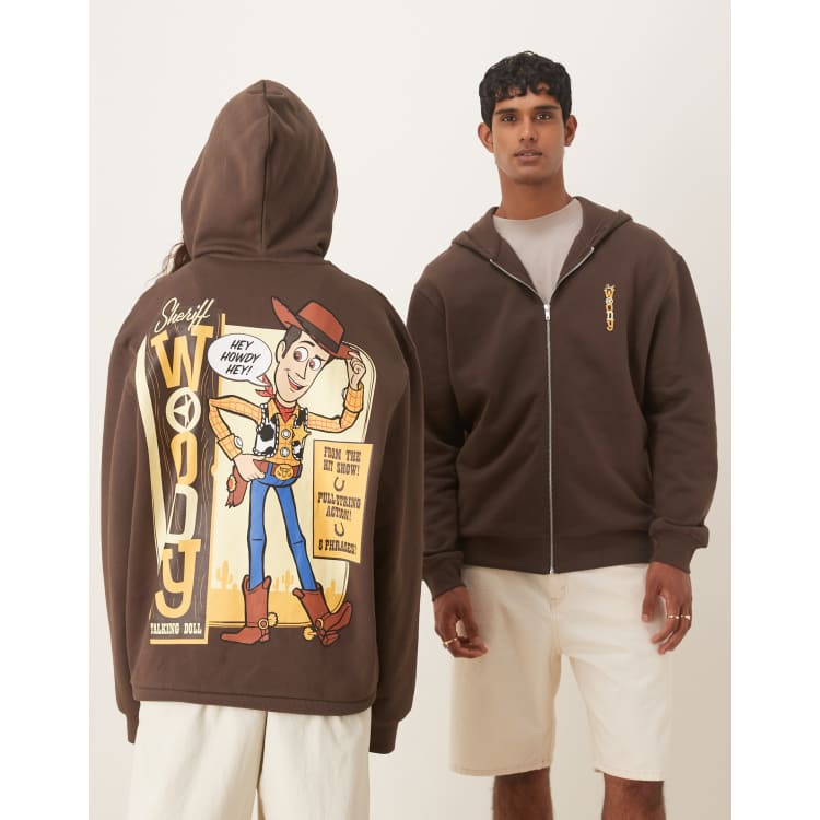 ASOS DESIGN Disney Pixar Relaxed zip-up hoodie with Woody Toy
