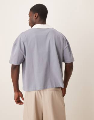ASOS DESIGN Disney Unisex boxy oversized dropped shoulders polo neck t-shirt with Mickey Mouse athletic prints in blue