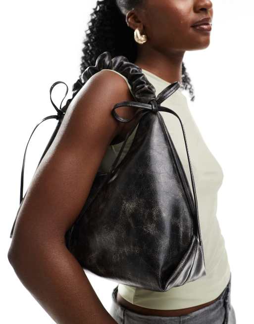 ASOS DESIGN distressed ruched handle shoulder bag with double bow detail in brown ASOS