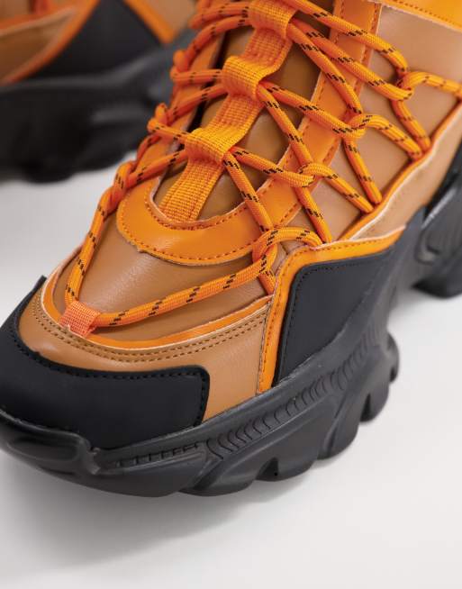 ASOS DESIGN District chunky hiking sneakers in orange black mix