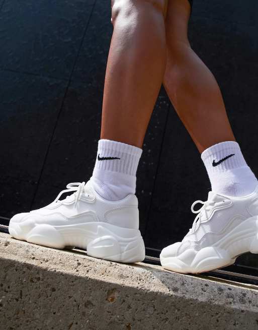 ASOS DESIGN sneakers in white with translucent blue sole