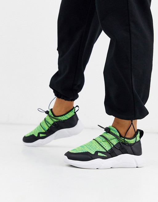 ASOS DESIGN Division knitted trainers in black and green