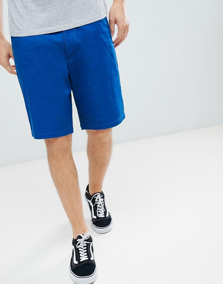 ASOS DESIGN – Djupblå shorts i smal och lång passform