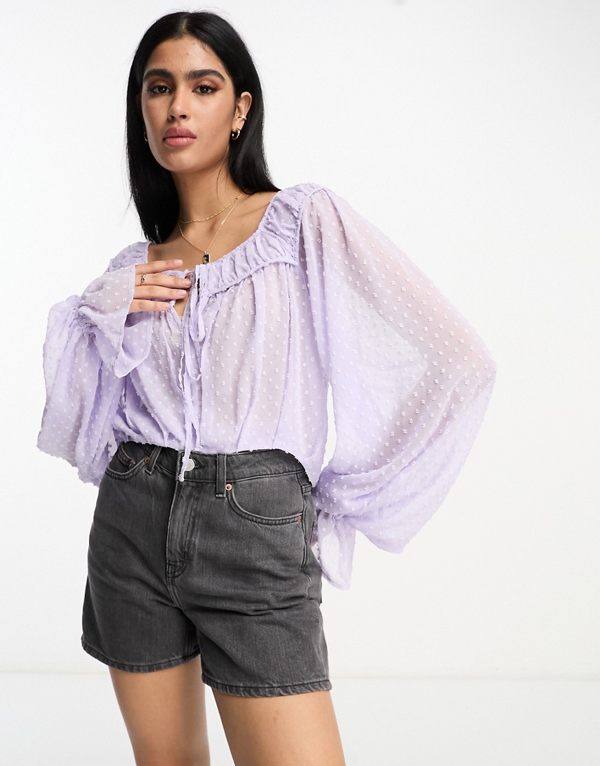 ASOS DESIGN dobby blouse with volume sleeve & tie front in lavender-Purple