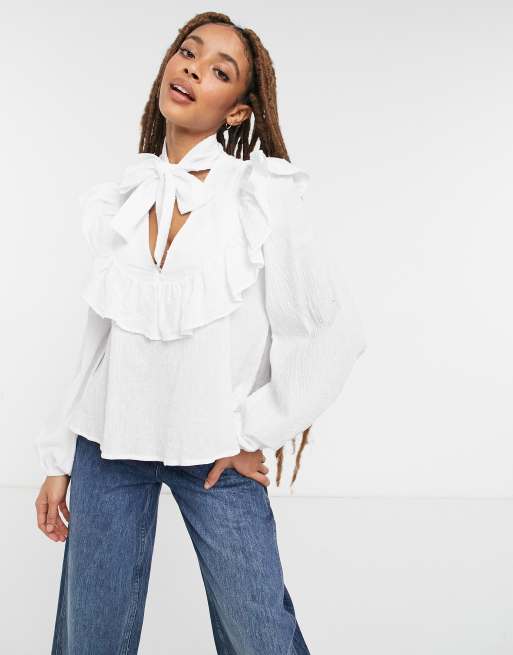 ASOS DESIGN dobby cotton pussybow blouse with ruffle detail in ivory | ASOS