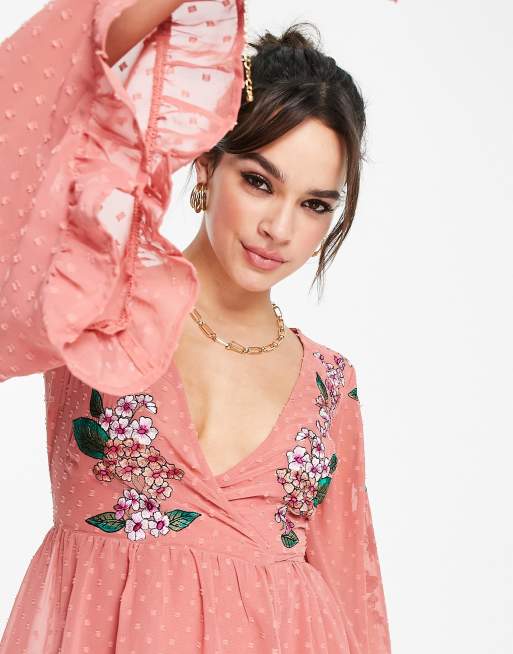 ASOS DESIGN dobby wrap mini skater dress with frills and floral embroidery in peach