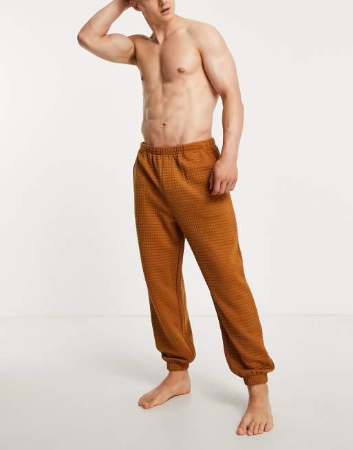 ASOS DESIGN - Doorgestikte lounge-joggingbroek in bruin
