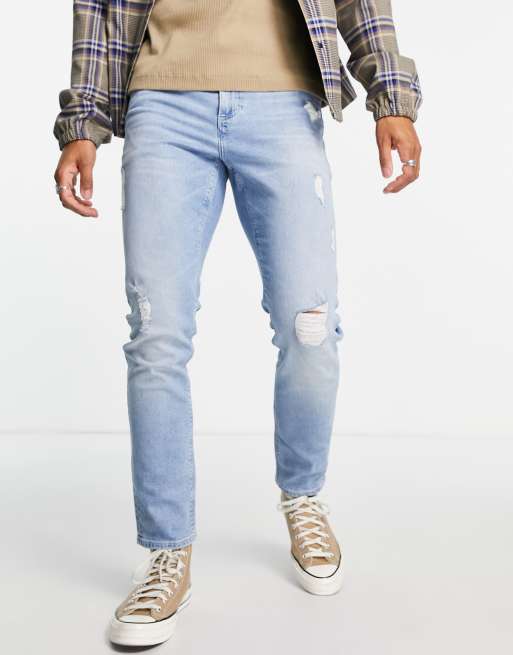 ASOS DESIGN – Dopasowane jeansy ze stretchem z przetarciami w odcieniu spranego błękitu w stylu vintage