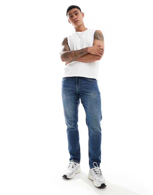ASOS DESIGN – Dopasowane niebieskie jeansy