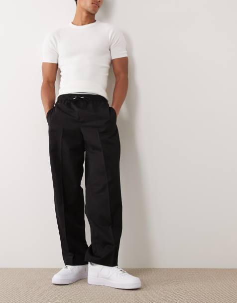 ASOS DESIGN – Dopasowane wciągane czarne spodnie z szerokimi nogawkami - view 1