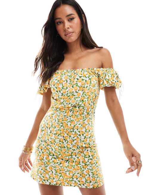 ASOS DESIGN draped mini dress with puff sleeve and bow detail in lemon print
