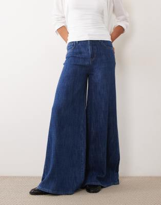 ASOS DESIGN drapey denim super wide leg jean in mid blue | ASOS
