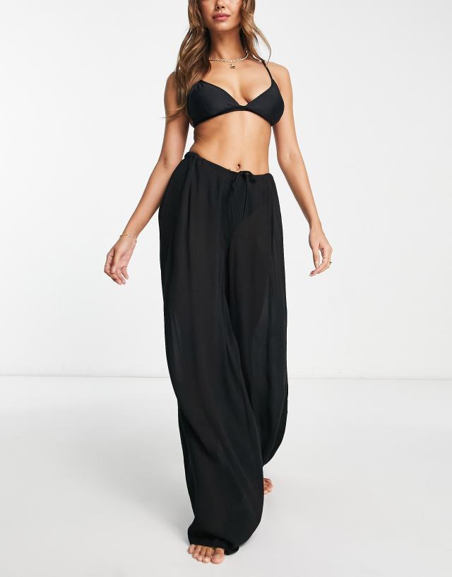 ASOS DESIGN drawstring palazzo beach pants in black