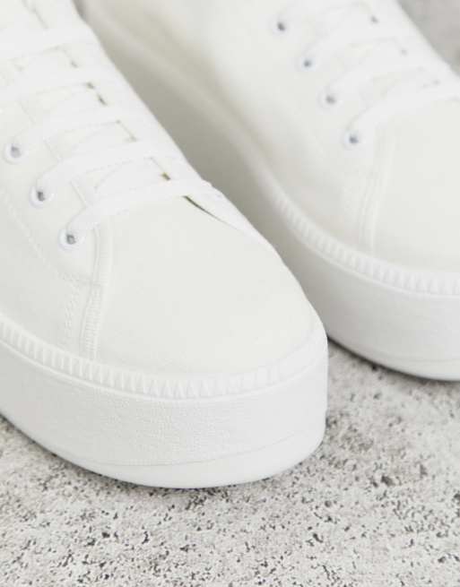 ASOS DESIGN sneakers in white with translucent blue sole