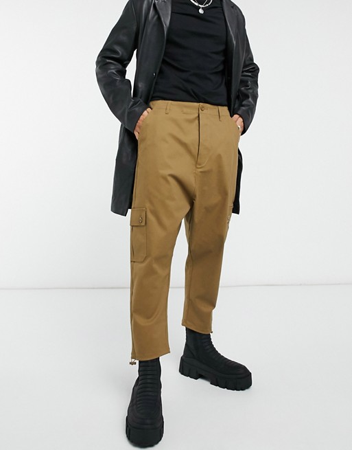 ASOS DESIGN drop crotch cargo trousers in brown with toggles