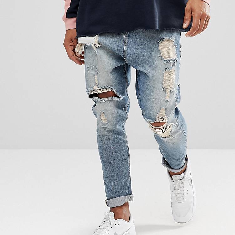 Drop crotch jeans in vintage light wash with heavy rips Asos Men Clothing Jeans Tapered Jeans 