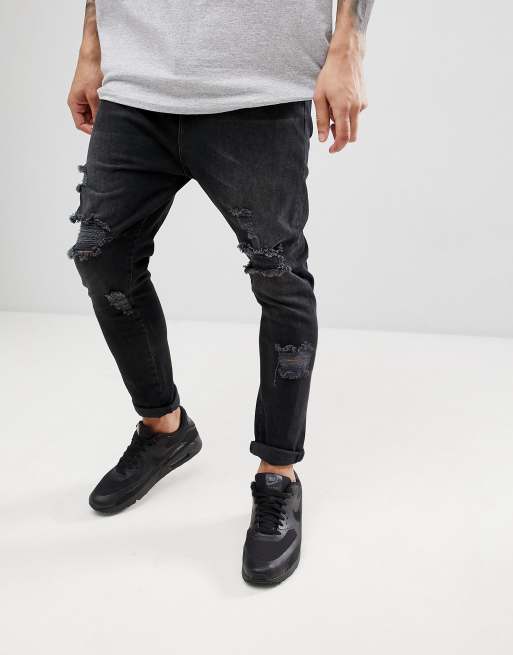 ASOS DESIGN drop crotch jeans in washed black with heavy rips ASOS