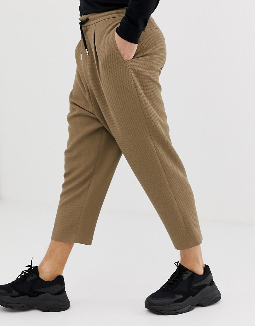 ASOS DESIGN drop crotch tapered crop smart trousers in camel with drawcord-Beige