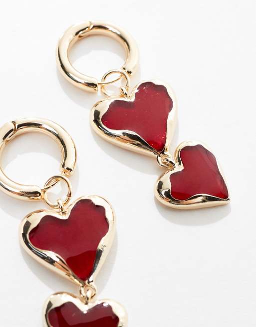 ASOS DESIGN drop earrings with red heart detail in gold tone ASOS