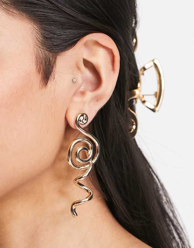 ASOS DESIGN drop earrings with sculptural design in gold tone