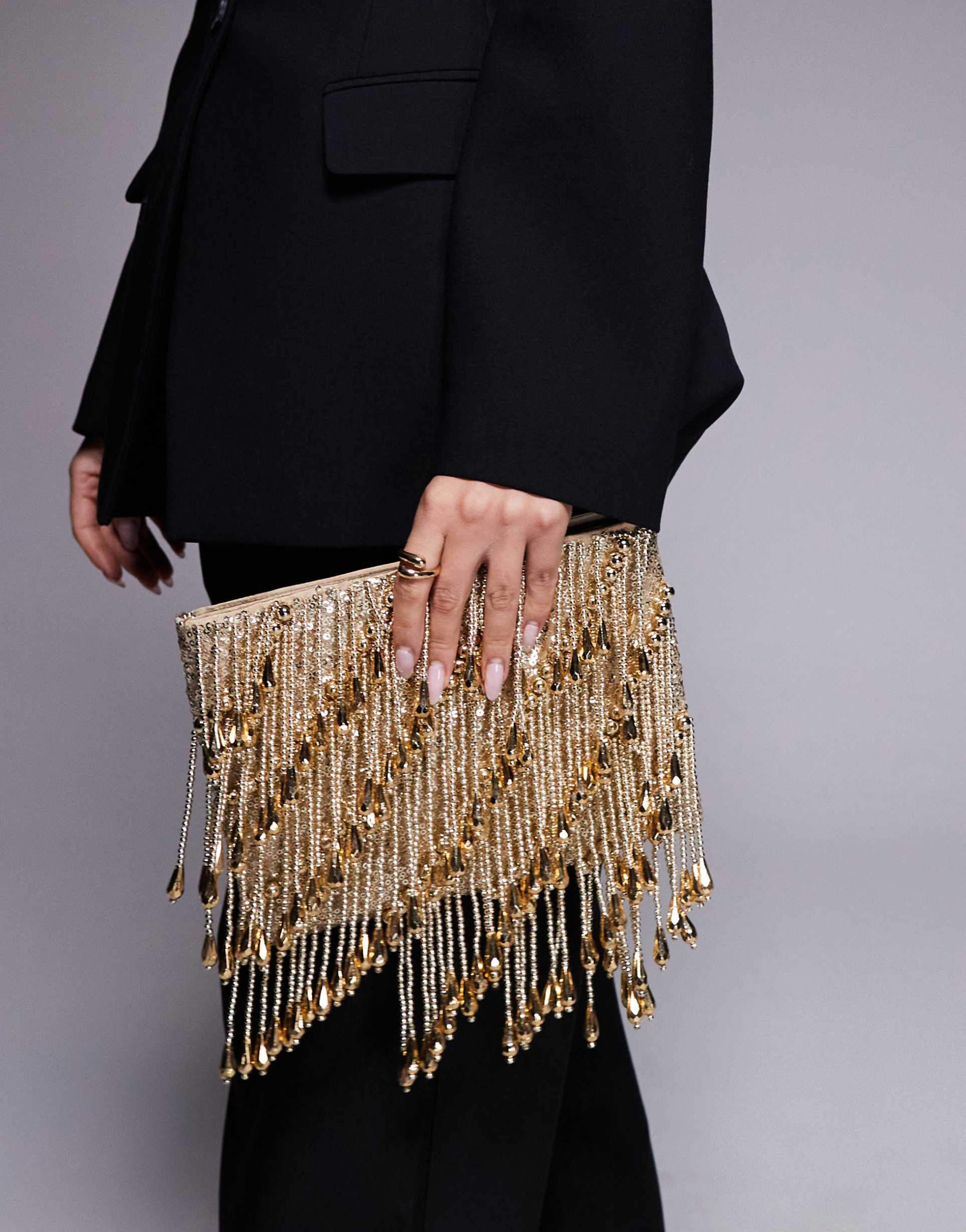 asos design droplet zip top clutch bag in gold