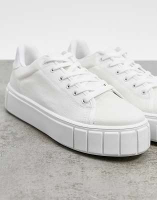 asos design sneakers in white canvas