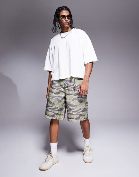ASOS DESIGN long length shorts with carpenter detailing in camo