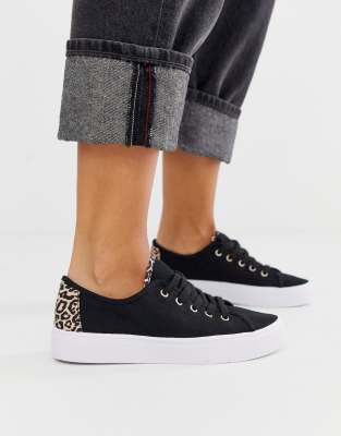 leopard and black trainers