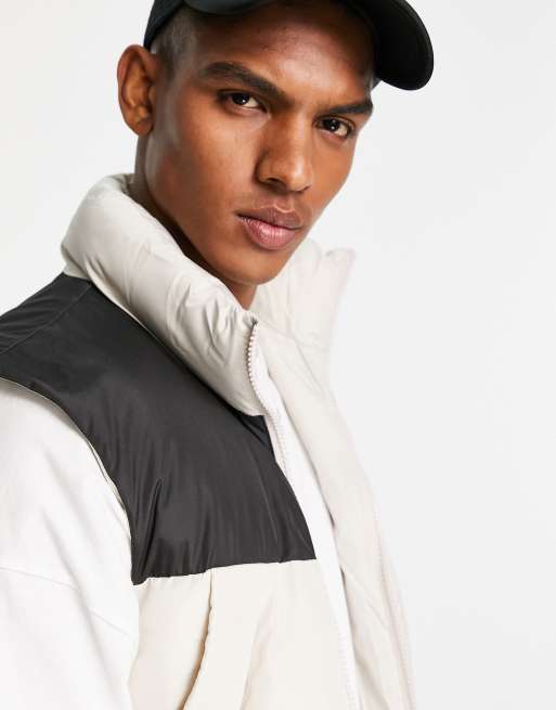 ASOS DESIGN - Dynevest i beige med komtrastfarvet bærestykke i sort, 2 af 4