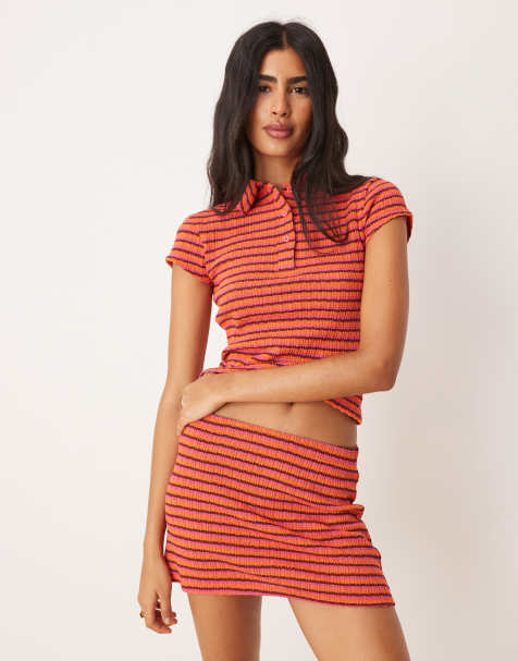 ASOS DESIGN textured knit shrunken polo top co-ord in mixed pink & red stripe