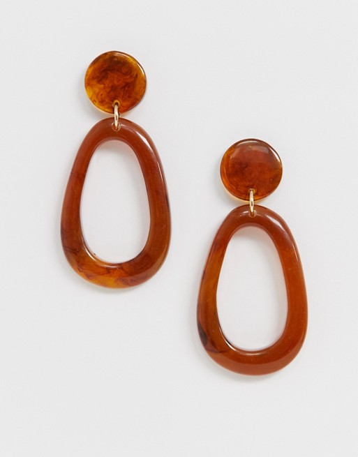 ASOS DESIGN earrings in open shape with amber style resin